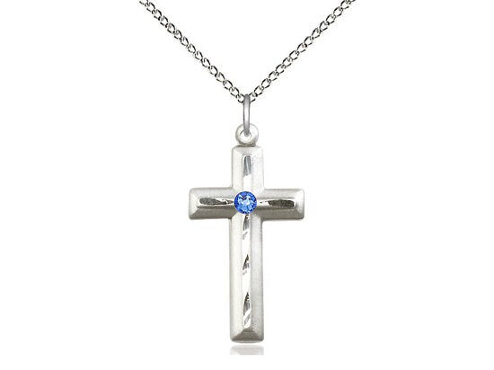 Sterling Silver Cross Pendant with a 3mm Sapphire Swarovski stone on a 18 inch Sterling Silver Light Curb Chain.